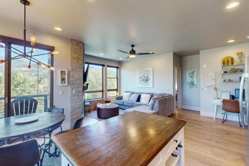 a living room with a couch and a table at Blue River Condo Unit 3301 in Silverthorne
