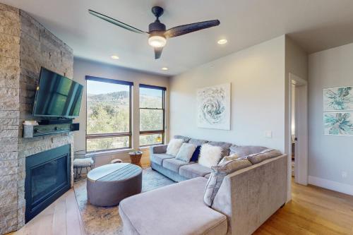 a living room with a couch and a fireplace at Blue River Condo Unit 3301 in Silverthorne