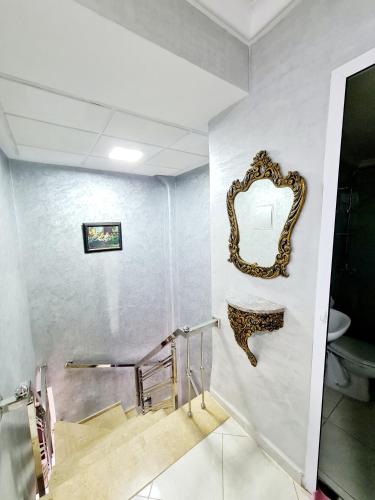 a bathroom with a mirror on the wall at Luxury Apartment Fes - Family Suites in Fès