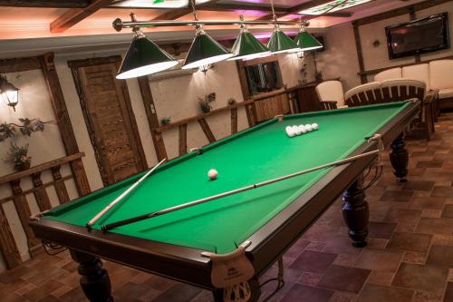 a pool table in a room with a pool ball at Gorny Ruchej in Hora