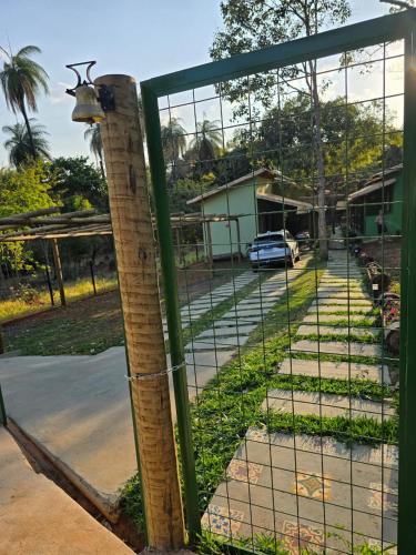 a fence with a deer head on top of it at Pousada Cigarras da Serra in Serra do Cipo