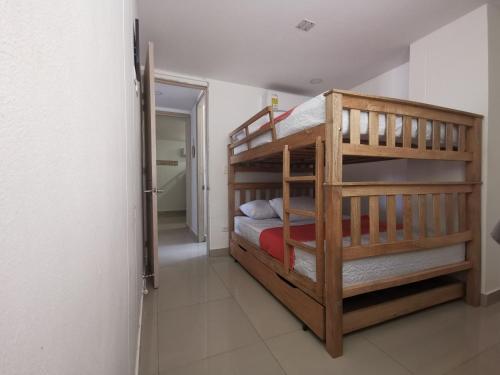 a bedroom with two bunk beds in a room at Apartamento 301 - Edificio Salomon Diaz in Santa Marta