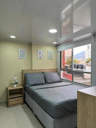 Postel nebo postele na pokoji v ubytování Hostelfc Chapinero