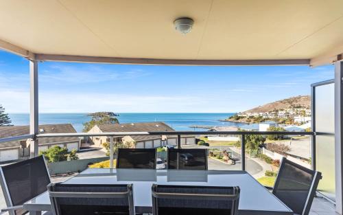 a dining room with a view of the ocean at Blue Horizon -Unit 5, 2 Solway Crescent, Encounter Bay in Encounter Bay