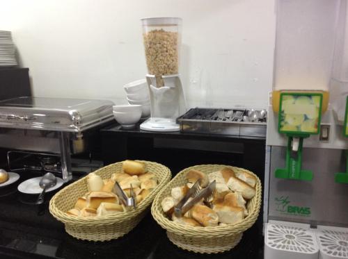 two baskets of bread and food in a kitchen at Hotel America do Sul in Sao Paulo