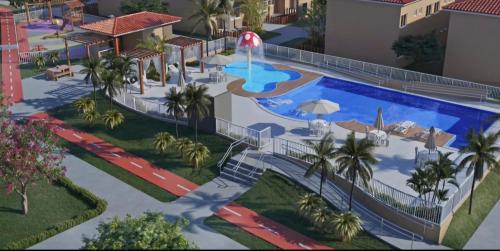 ein Resort mit einem Pool in der Unterkunft Ap 2 quartos tipo resort pé na areia 2 in Aracaju