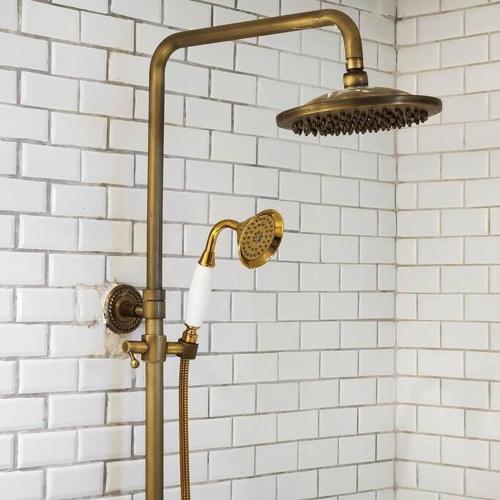 a shower with a shower head in a bathroom at Siraburi boutique pool villa at Center of old town in Chiang Mai