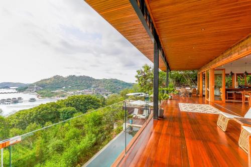an outdoor deck with a view of the water at Paradise Garage Komodo Villa in Labuan Bajo