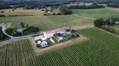 an aerial view of a farm house in a field at Bubulles dans les vignes in Le Fieu