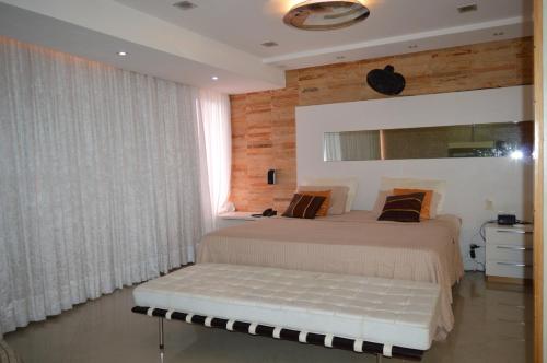 Säng eller sängar i ett rum på Apartamento Fortaleza Beira Mar