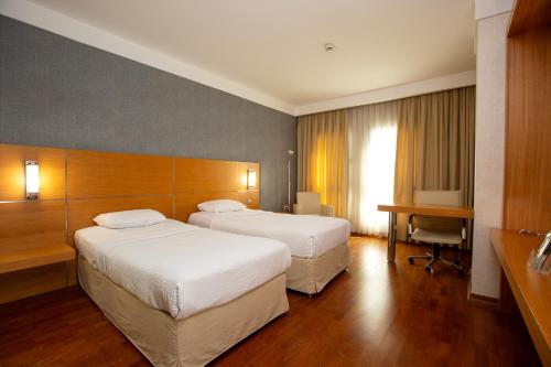 Postel nebo postele na pokoji v ubytování Anemon Grand Malatya Otel