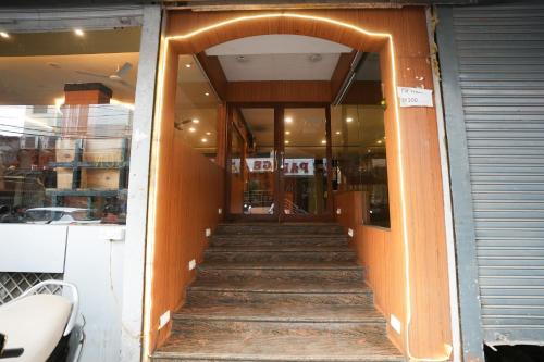 a stairway leading into a building with an archway at Hotel Madurai near Central Bus Stand, Udaipur in Udaipur