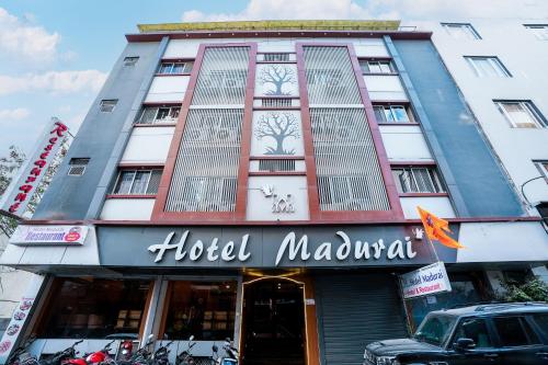 a building with a hotel mumbai in front of it at Hotel Madurai near Central Bus Stand, Udaipur in Udaipur