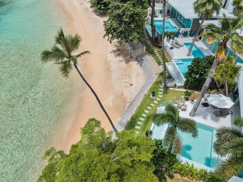 an aerial view of a beach and the ocean at Beachfront Secret Tides Villa Tierra in Bangrak Beach