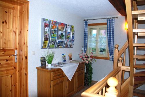 a room with a wooden desk in a house at FH Am Osterbrunnen in Hinterhermsdorf