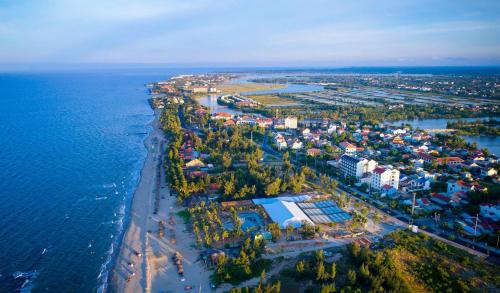 an aerial view of a city next to the water at Ally Beach Boutique Hotel Hoian in Hoi An