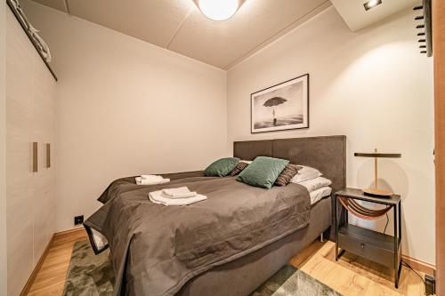 a bedroom with a large bed in a room at Ski Chalet C10 Levi Center incl 2 ski passes by Aavalevi in Levi