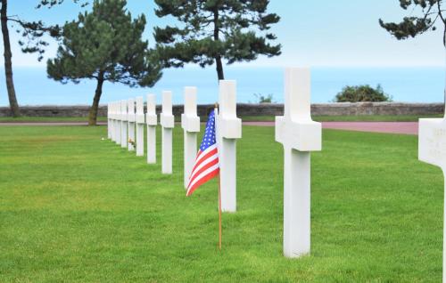 an american flag in front of a white cemetery at Awesome Home In Rubercy With Sauna in Rubercy