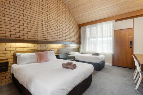 Ein Bett oder Betten in einem Zimmer der Unterkunft Maffra Motor Inn