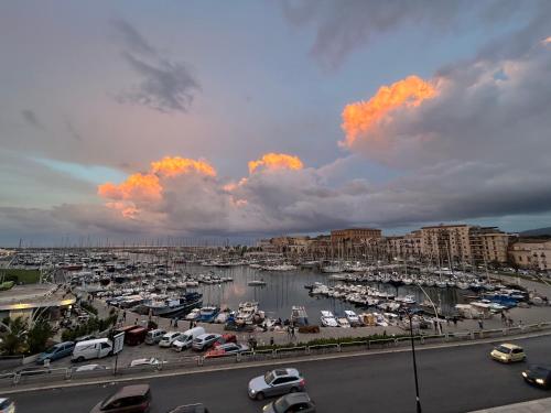 a marina with a bunch of boats in a harbor at CalaMia in Palermo