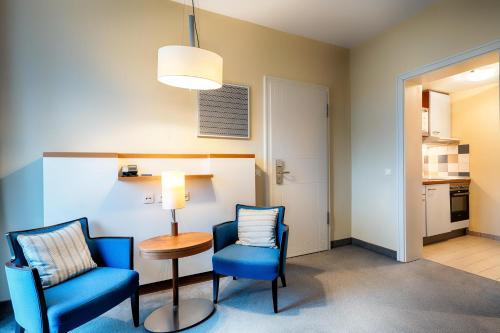 Welcome Hotel Meschede Henneseeにあるキッチンまたは簡易キッチン