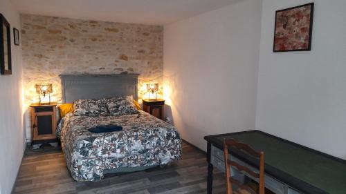 Ένα ή περισσότερα κρεβάτια σε δωμάτιο στο Le Clos des Quatre Lieues