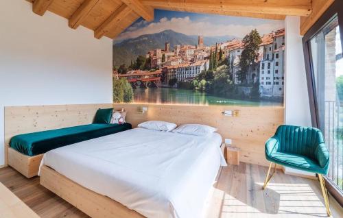 a bedroom with a large painting on the wall at Chalet Dolce Colle in Volpago del Montello