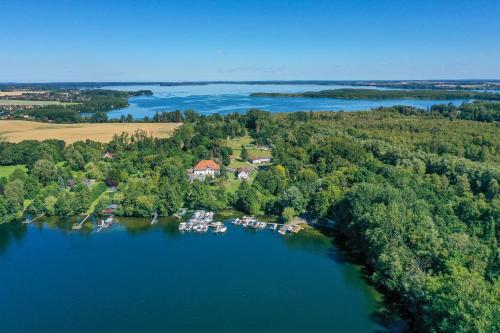 an aerial view of a house on a lake at Seehotel Frankenhorst - BW Signature Collection in Schwerin