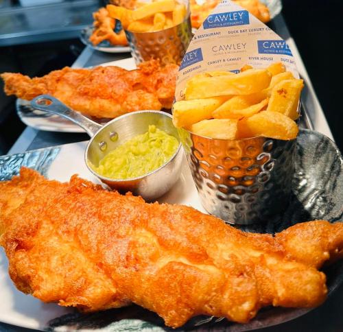 a plate of food with fish and chips and dip at Duck Bay Hotel & Restaurant in Balloch