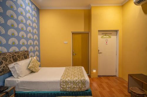 Una cama o camas en una habitación de Tara Guest House