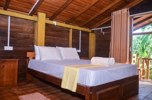 Postel nebo postele na pokoji v ubytování Triangle Home Stay