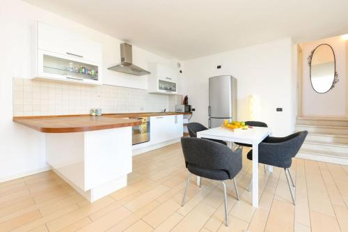 Η κουζίνα ή μικρή κουζίνα στο Alba Apartment