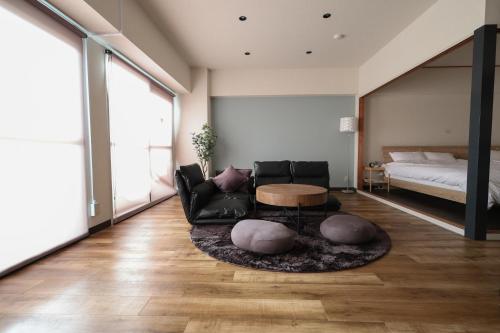 Ένα ή περισσότερα κρεβάτια σε δωμάτιο στο RIVER WEST HIROSHIMA