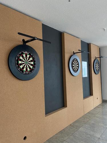 a dartboard hanging on a wall in a room at Sportschule Oberhaching in Oberhaching