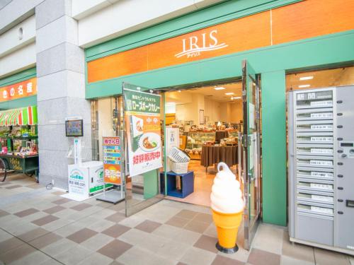 an entrance to an ice cream shop with an ice cream cone at FLEXSTAY INN Kashima Central in Kamisu