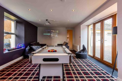 a living room with a pool table in it at Elderberry Hall The Ultimate Family Reunion HQ in Fishburn