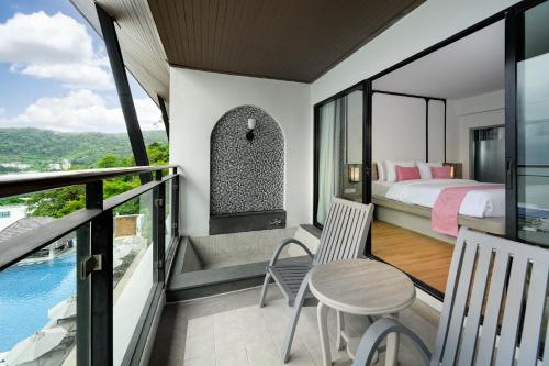 Postel nebo postele na pokoji v ubytování Andamantra Resort and Villa Phuket