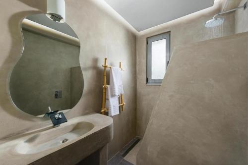 a bathroom with a sink and a mirror at Luxury villa in Lachania near sea in Lachania