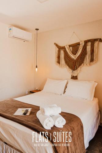 Postel nebo postele na pokoji v ubytování FLATS SUITE - Experiência e Conforto na charmosa Vila de São Jorge, Goiás