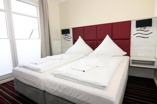 Ένα ή περισσότερα κρεβάτια σε δωμάτιο στο Apartments in the Avalon Hotel Bellevue Fehmarn