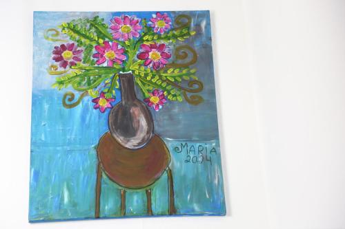 a painting of a vase with flowers in it at 3BR Luxury Stay Near Billing Aquadrome - Elegant 3-Bedrooms One-and-Half Bathrooms Home - Sleeps 8 - Free Parking and Complimentary Access to Billing Aquadrome Holiday Village in Northampton