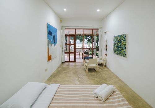 Postel nebo postele na pokoji v ubytování Loogmai Guesthouse Chiang Khan - เรือนแรมลูกไม้ เชียงคาน