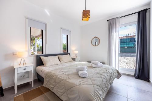 Ένα ή περισσότερα κρεβάτια σε δωμάτιο στο Yucca Garden Villas