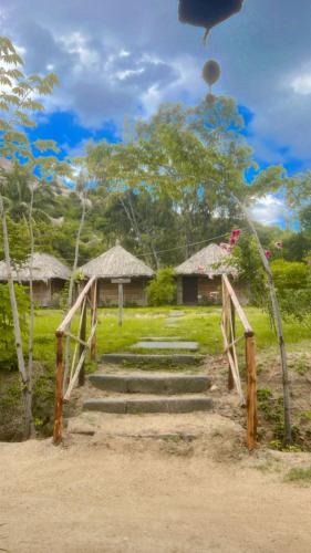 a set of stairs leading to a house with at Banana Tree Home Stay in Hampi
