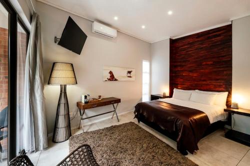 Ένα ή περισσότερα κρεβάτια σε δωμάτιο στο Alpine Attitude Boutique Hotel & Conference Venue