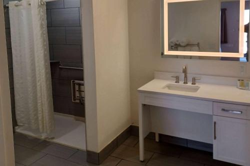 a bathroom with a sink and a shower at Howard Johnson by Wyndham Springerville in Springerville