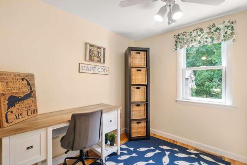 a home office with a desk and a window at Game Room Walk to Nantucket Sound in Chatham