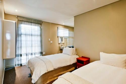 Ένα ή περισσότερα κρεβάτια σε δωμάτιο στο Alpine Attitude Boutique Hotel & Conference Venue