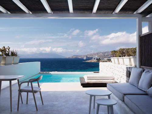 a living room with a view of the ocean at Mykonos Earth Suites in Mýkonos City