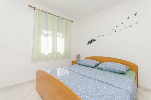 Postel nebo postele na pokoji v ubytování Apartments Danica